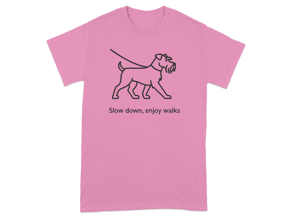 Pink t-shirt with line drawing of a dog on a leash and text "Slow down, enjoy walks."