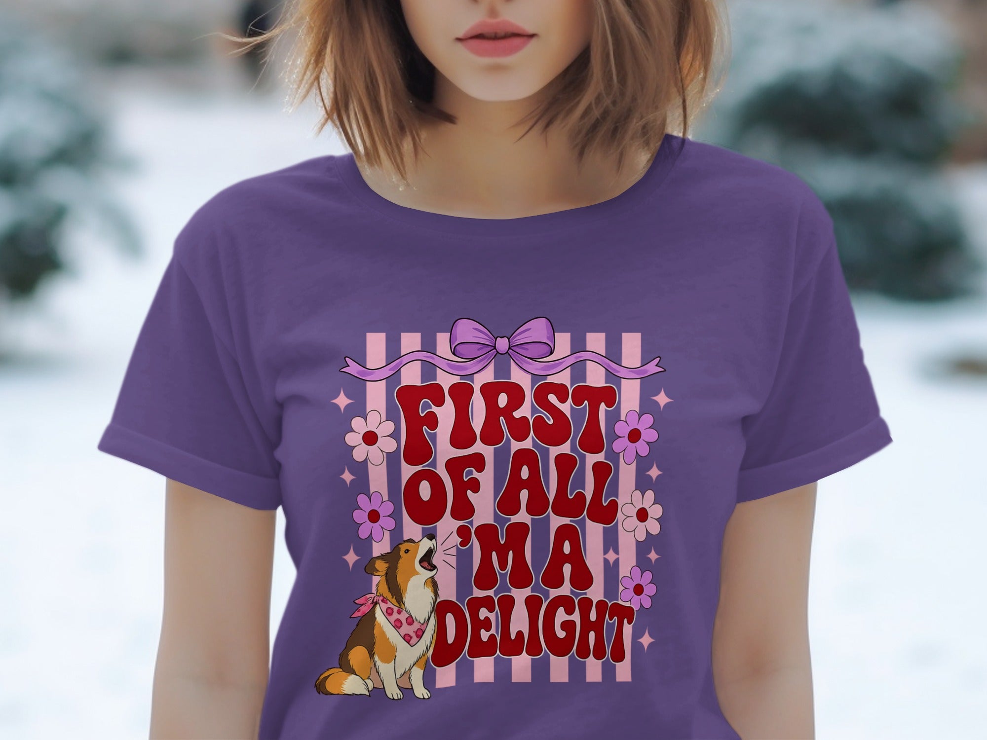 Purple t-shirt with a dog and text "FIRST OF ALL 'M A DELIGHT".