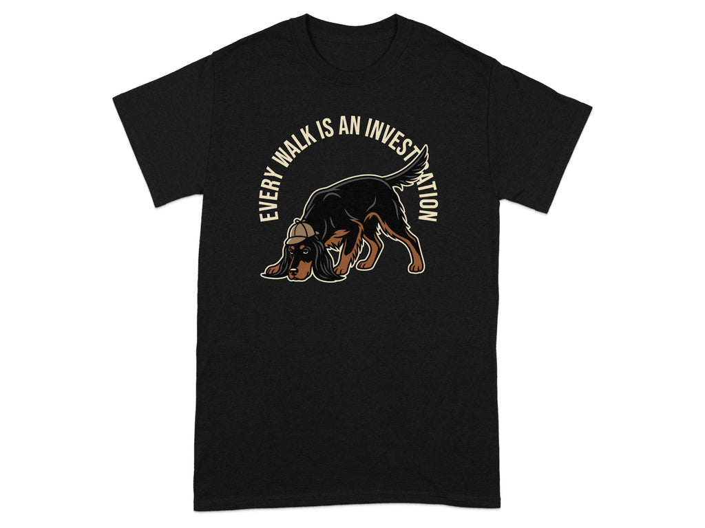 Black t-shirt with a brown dog sniffing the ground and text "Every Walk Is An Investigation".