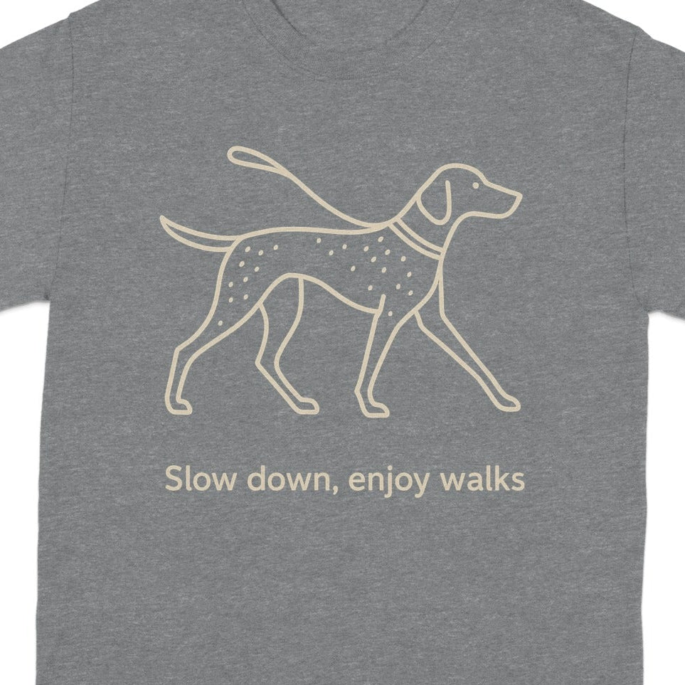 Grey t-shirt with line drawing of a dog on a leash and the text "Slow down, enjoy walks".