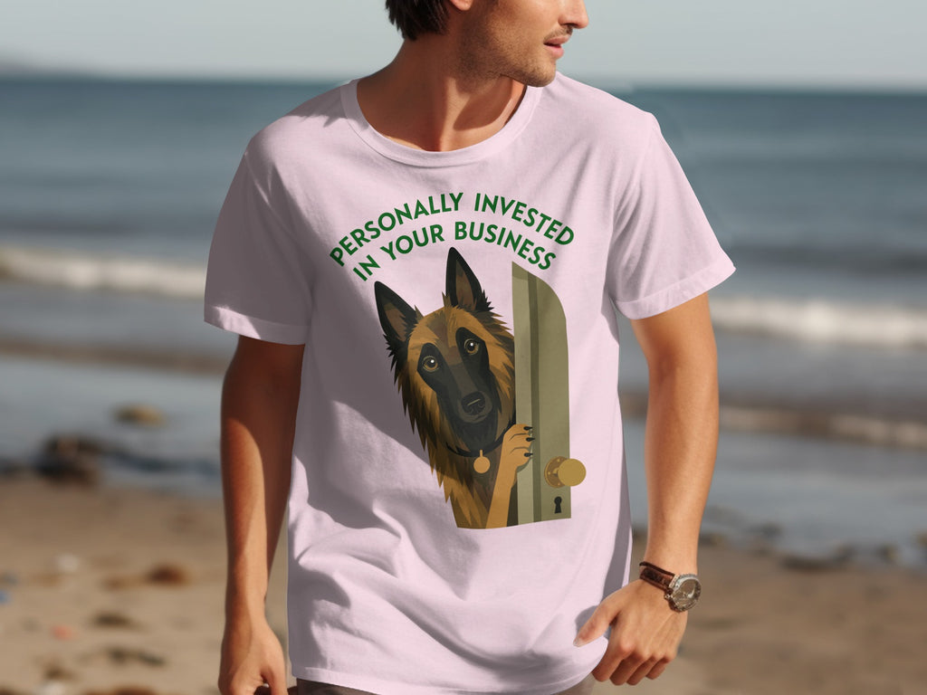 Man in pink t-shirt with dog peeking through a door graphic.