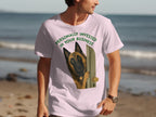 Man in pink t-shirt with dog peeking through a door graphic.