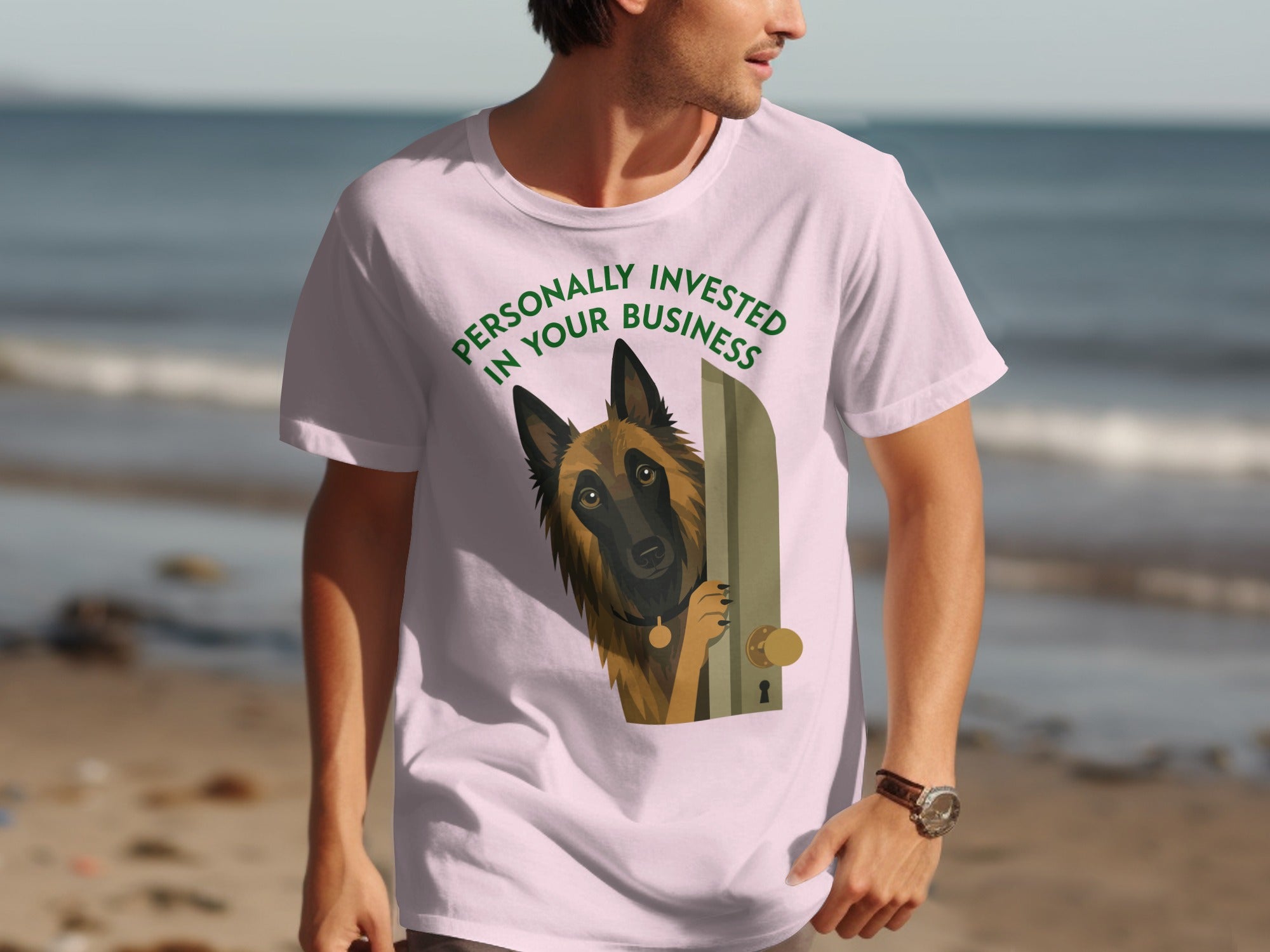 Man in pink t-shirt with dog peeking through a door graphic.