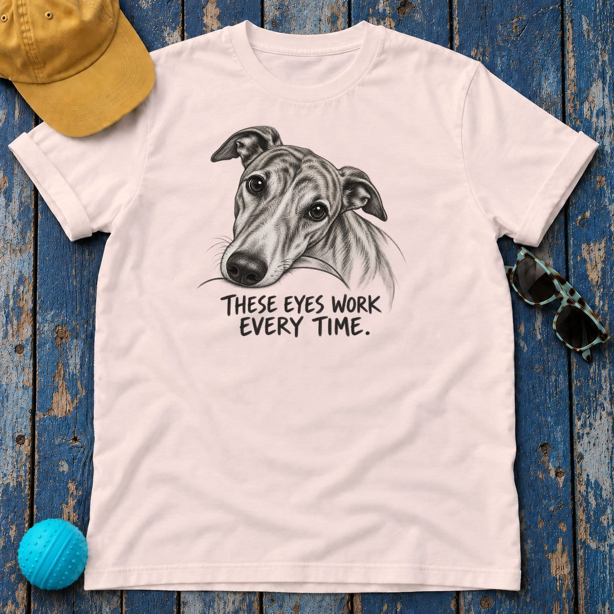 These Eyes Work Every Time Greyhound T-Shirt in Soft Pink - flat lay