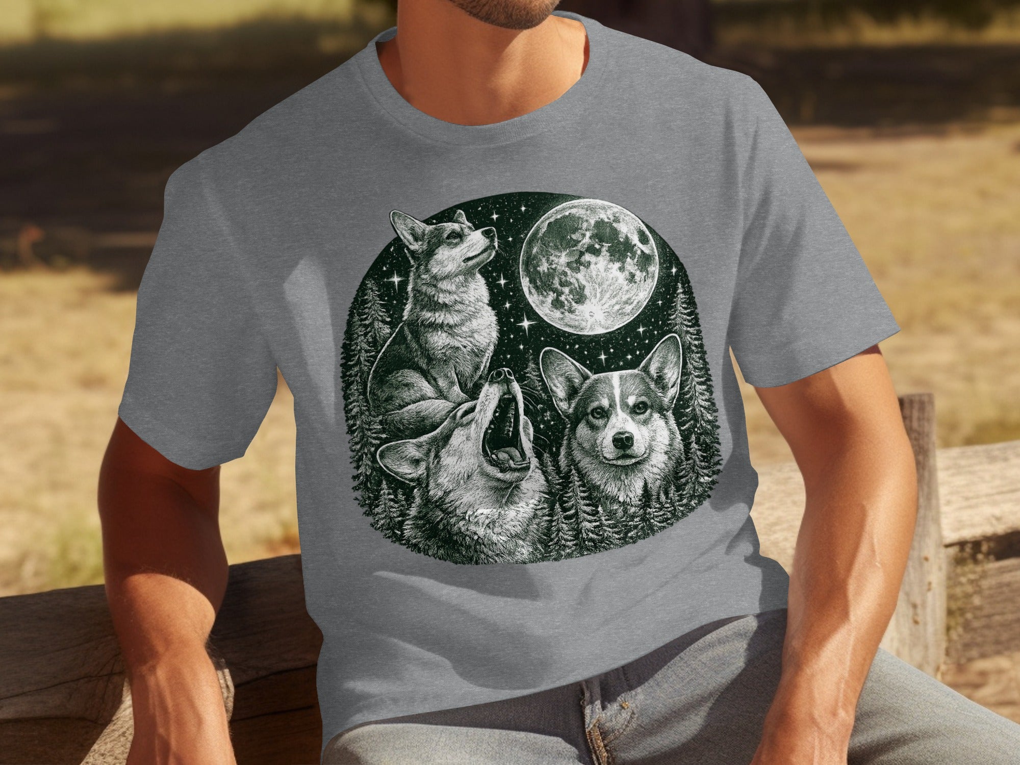 Three corgis with a moon and starry forest scene illustration on a gray t-shirt.
