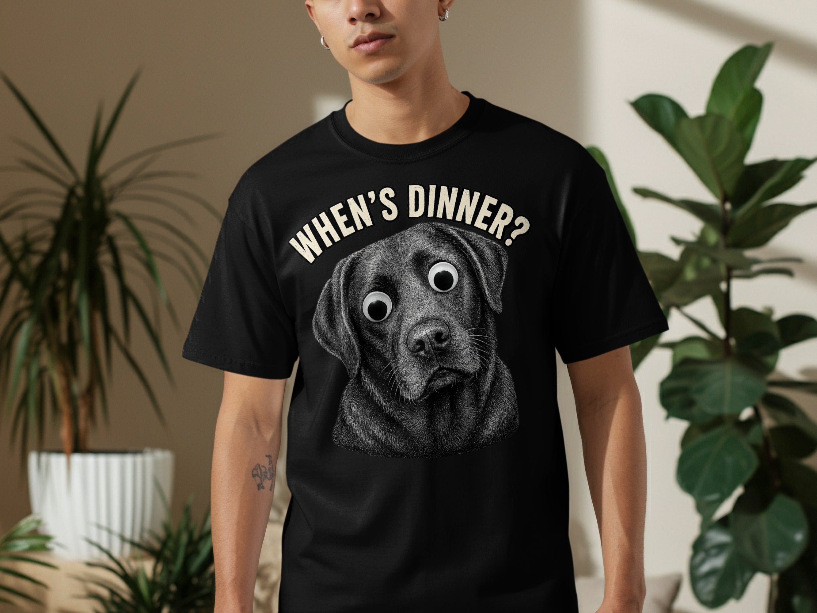 Black t-shirt with a surprised black dog graphic saying "WHEN'S DINNER?".