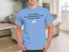 Light blue t-shirt with white text and dog graphic: "LIFE UPDATE: WE ARE BARKING AT THE VACUUM AGAIN".