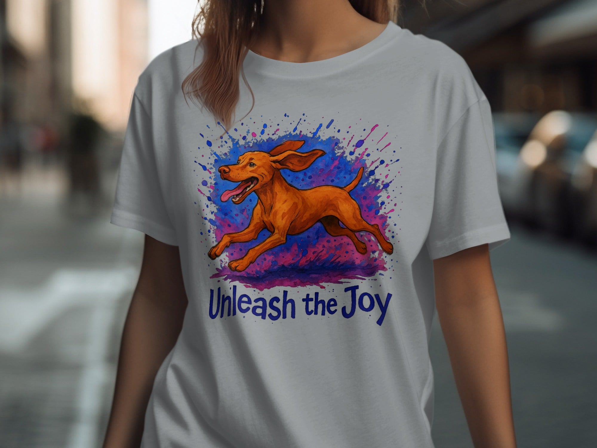 Gray t-shirt with a running brown dog and "Unleash the Joy" text design.
