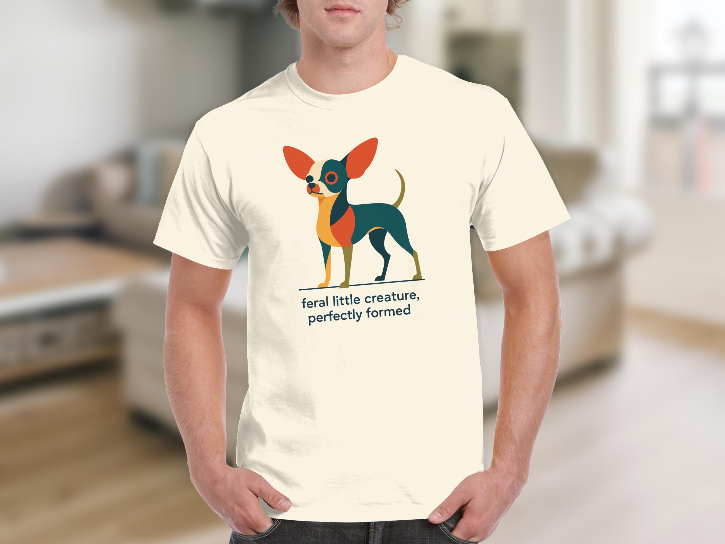 Cream t-shirt with geometric chihuahua graphic and text "feral little creature, perfectly formed".