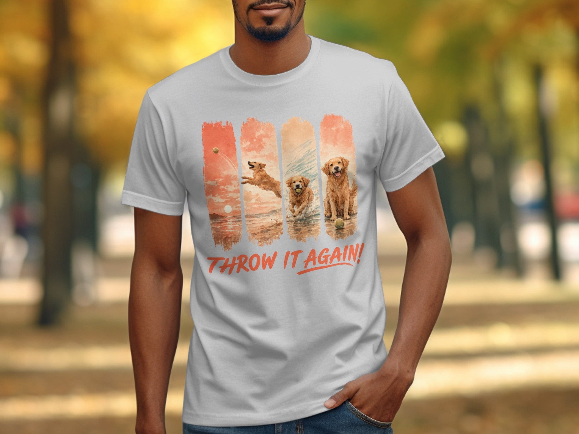 White t-shirt with four vertical panels of golden retrievers playing fetch, text "THROW IT AGAIN!".