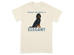 Cream t-shirt with dog graphic and text "VELCRO, BUT MAKE IT ELEGANT".