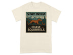 T-shirt graphic with dog and squirrel under mountains, reads "STAY WILD CHASE SQUIRRELS".