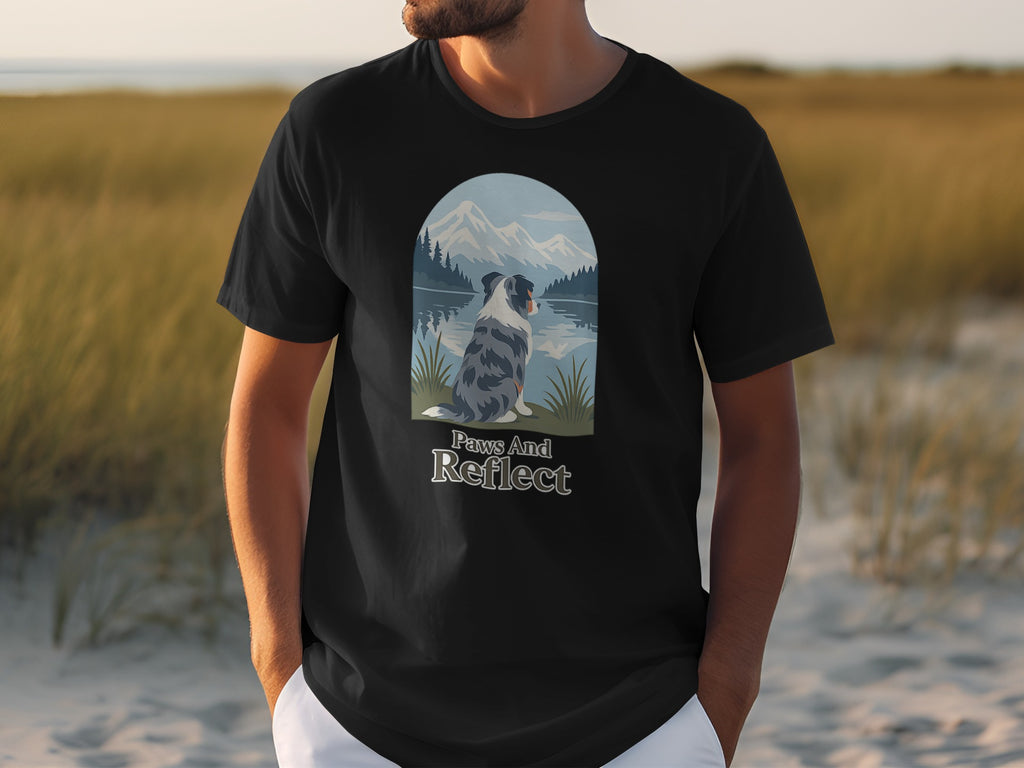 Black t-shirt with a graphic of a dog sitting beside a lake with mountains and trees.