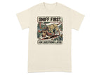 Cream t-shirt with cartoon dog wearing hat and jacket, saying "Sniff First Ask Questions Later".