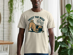 Cream t-shirt with a pug graphic and the text "TRUST THE NOSE".