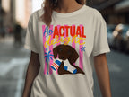 Dog holding sock with text "AN ACTUAL delight" on cream t-shirt.