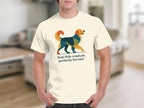 Cream t-shirt with a colorful geometric dog and text "feral little creature, perfectly formed."