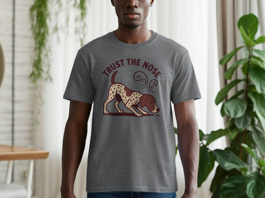 Grey t-shirt with a brown and white spotted dog sniffing the ground and text "TRUST THE NOSE".
