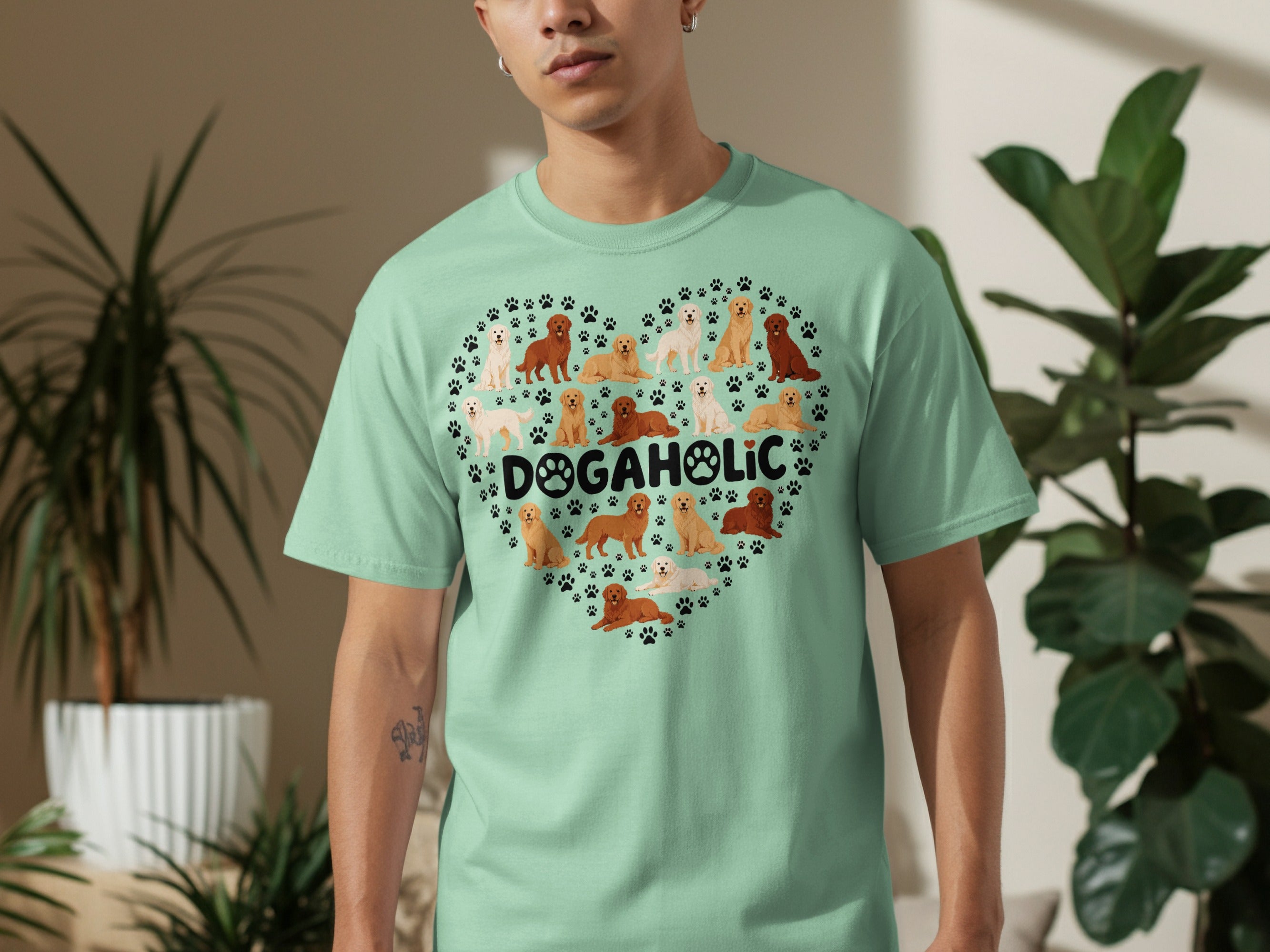 Heart-shaped graphic of various dogs on a light teal t-shirt.