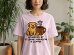 Pink t-shirt with cartoon yellow lab, coffee mug, paw print, and text.