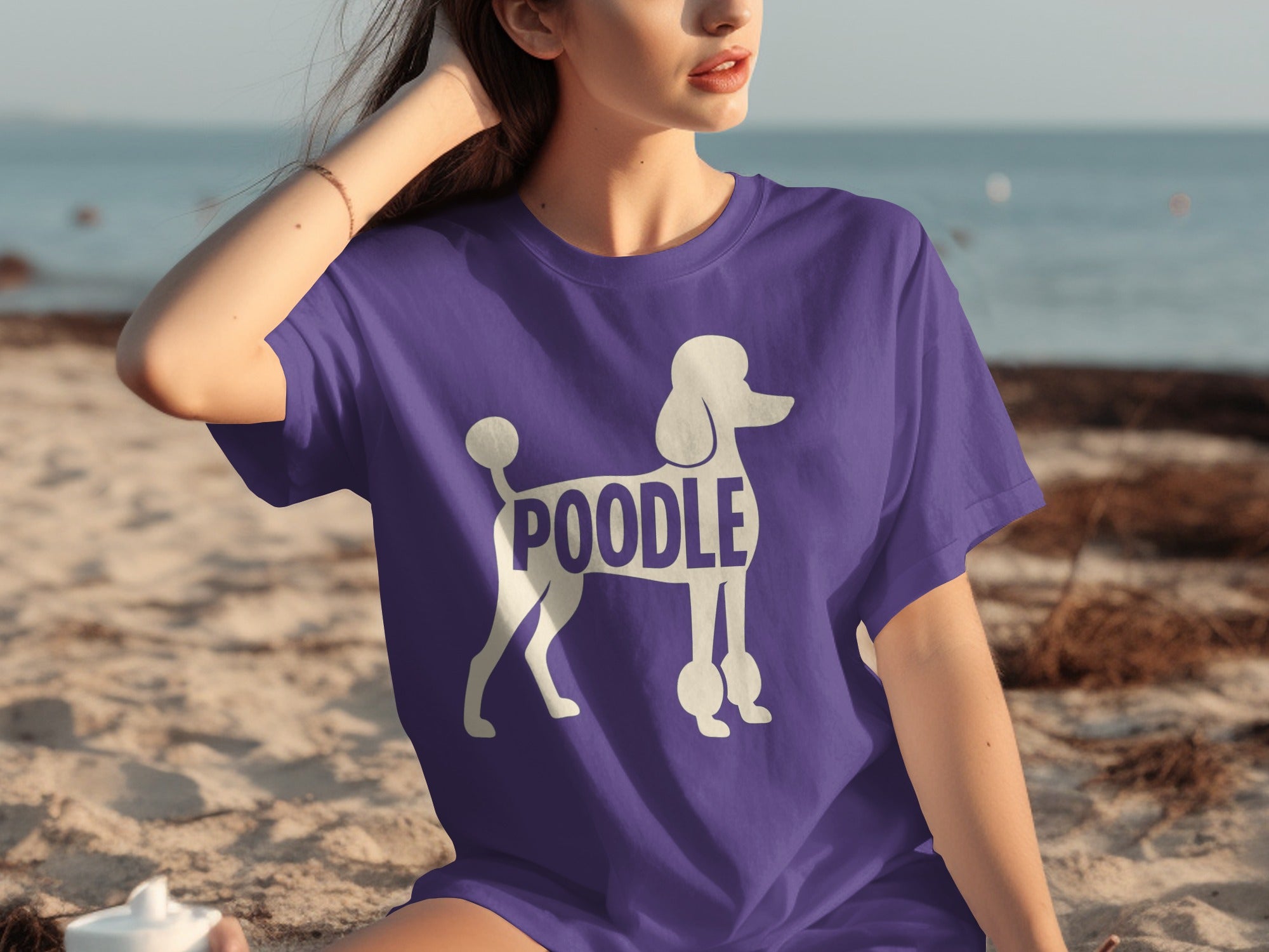 Purple t-shirt with a white poodle graphic and the word "POODLE" printed on it.