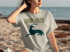 Grey t-shirt with "LUXURY ATHLETE AT REST" and a dog graphic.