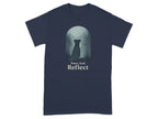 Dark t-shirt with "Paws And Reflect" text and dog by lake graphic.