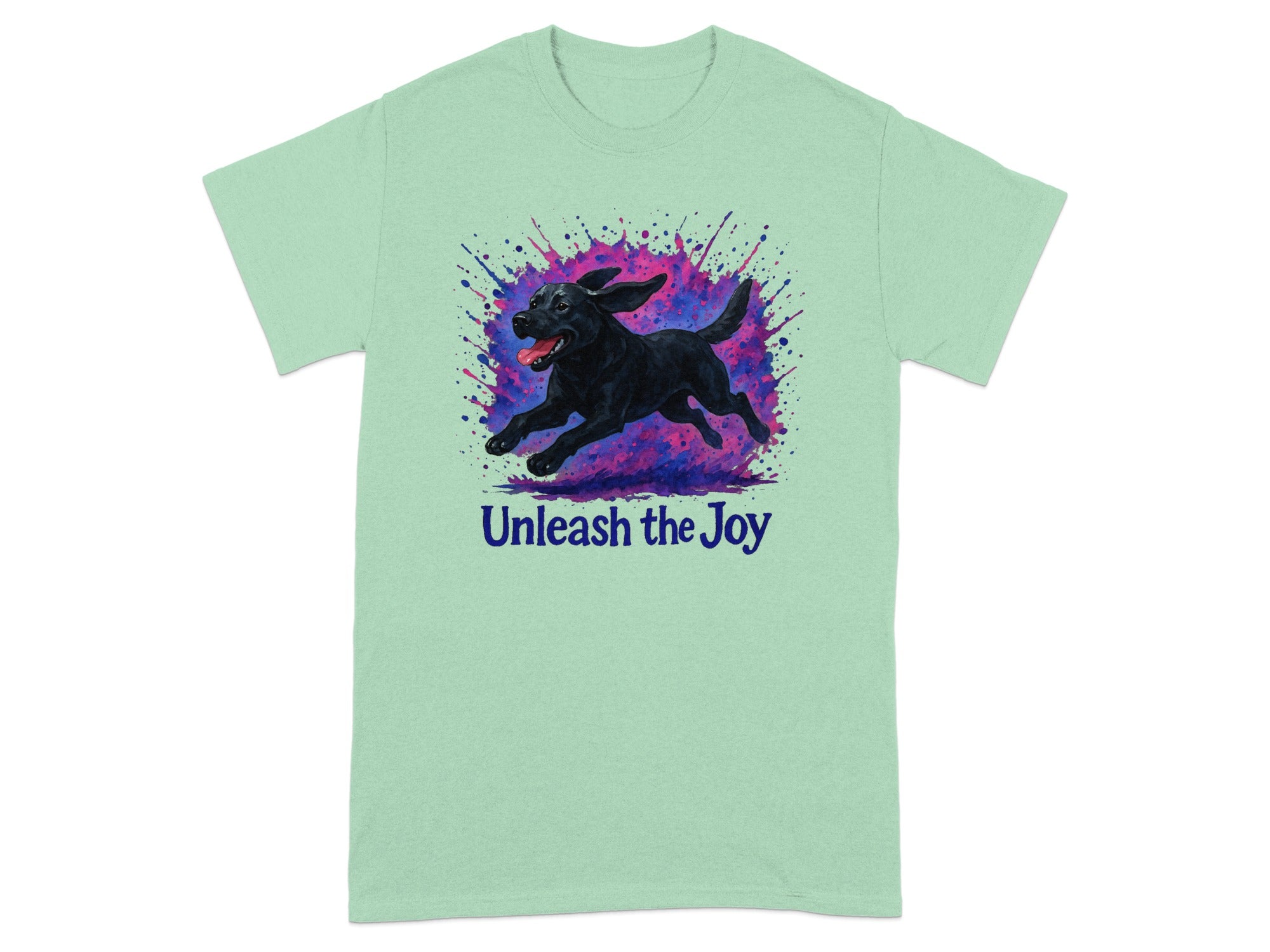 Mint t-shirt with black lab running through colorful paint splashes and text "Unleash the Joy."