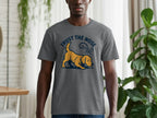 Dark gray t-shirt with a yellow dog graphic and text "TRUST THE NOSE"