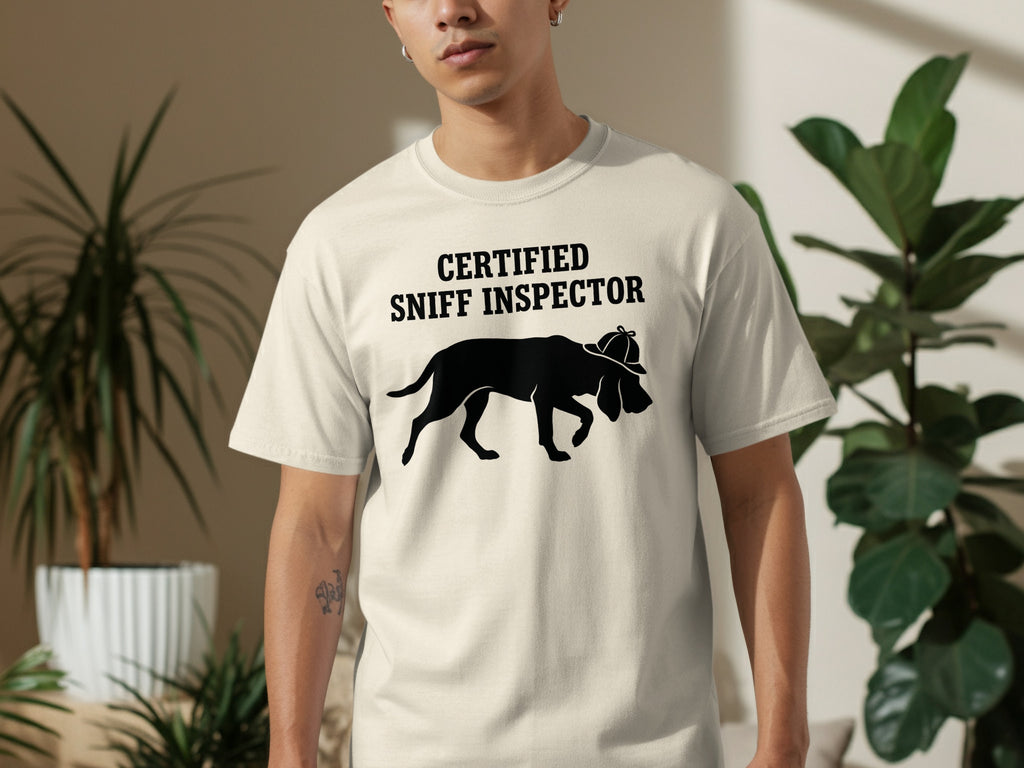 Cream t-shirt with black graphic of a dog wearing a hat and text "CERTIFIED SNIFF INSPECTOR".