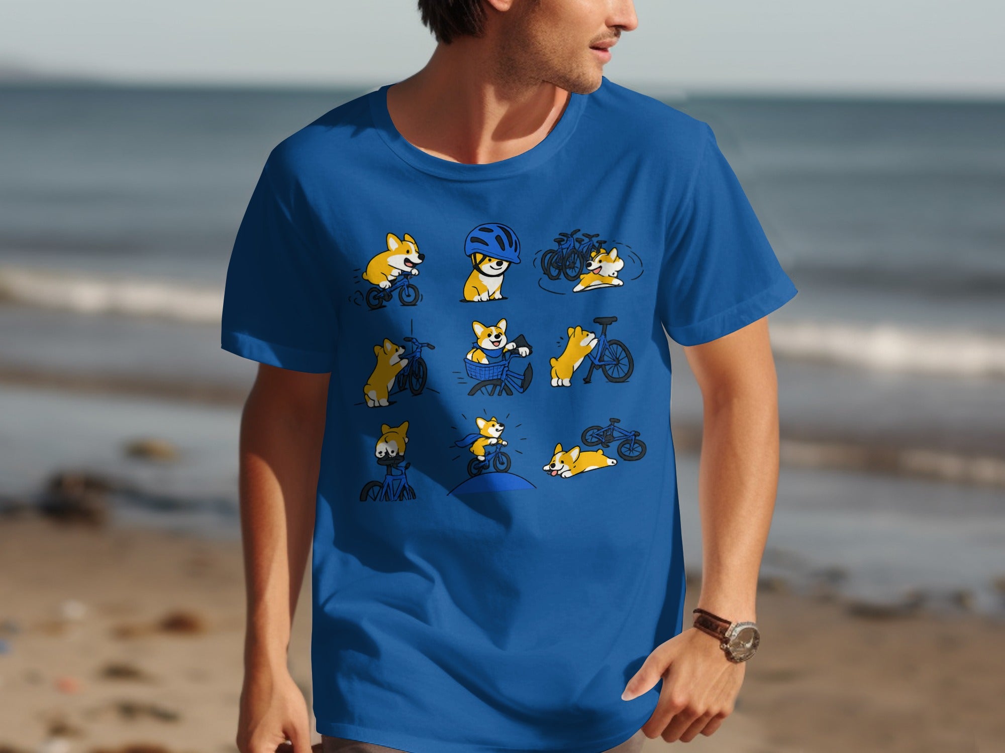Blue t-shirt with a collage of cartoon corgis riding bicycles and playing.