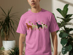 Pink t-shirt with four stylized dogs and stars pattern.