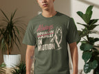 Green t-shirt with "Always Usually In Motion" text and wolf graphic.
