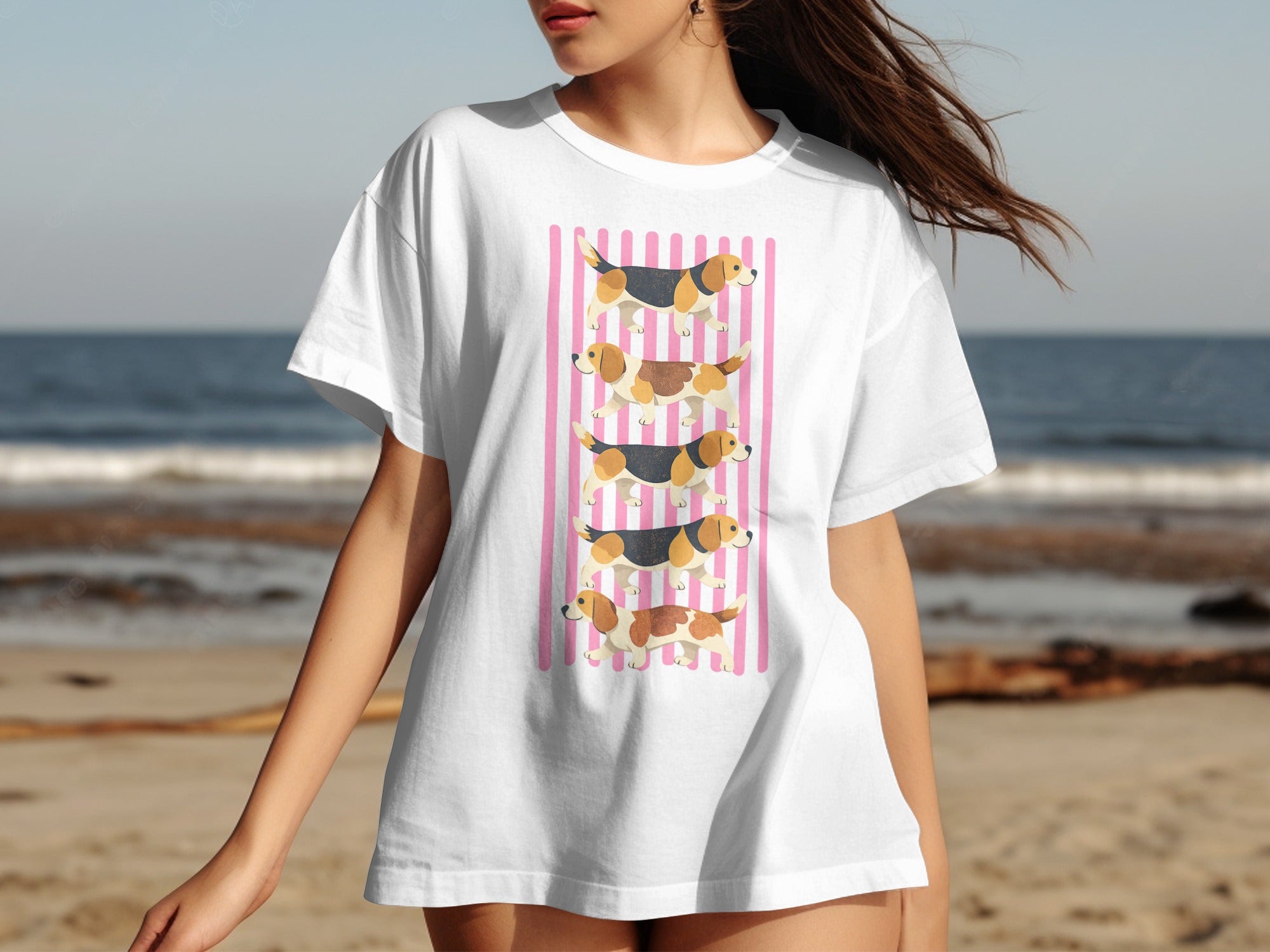 White t-shirt with a graphic of three beagles stacked vertically on pink stripes.