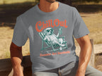 Man in grey t-shirt with "Chill Out Zoomies Are Inevitable" graphic of a dog.