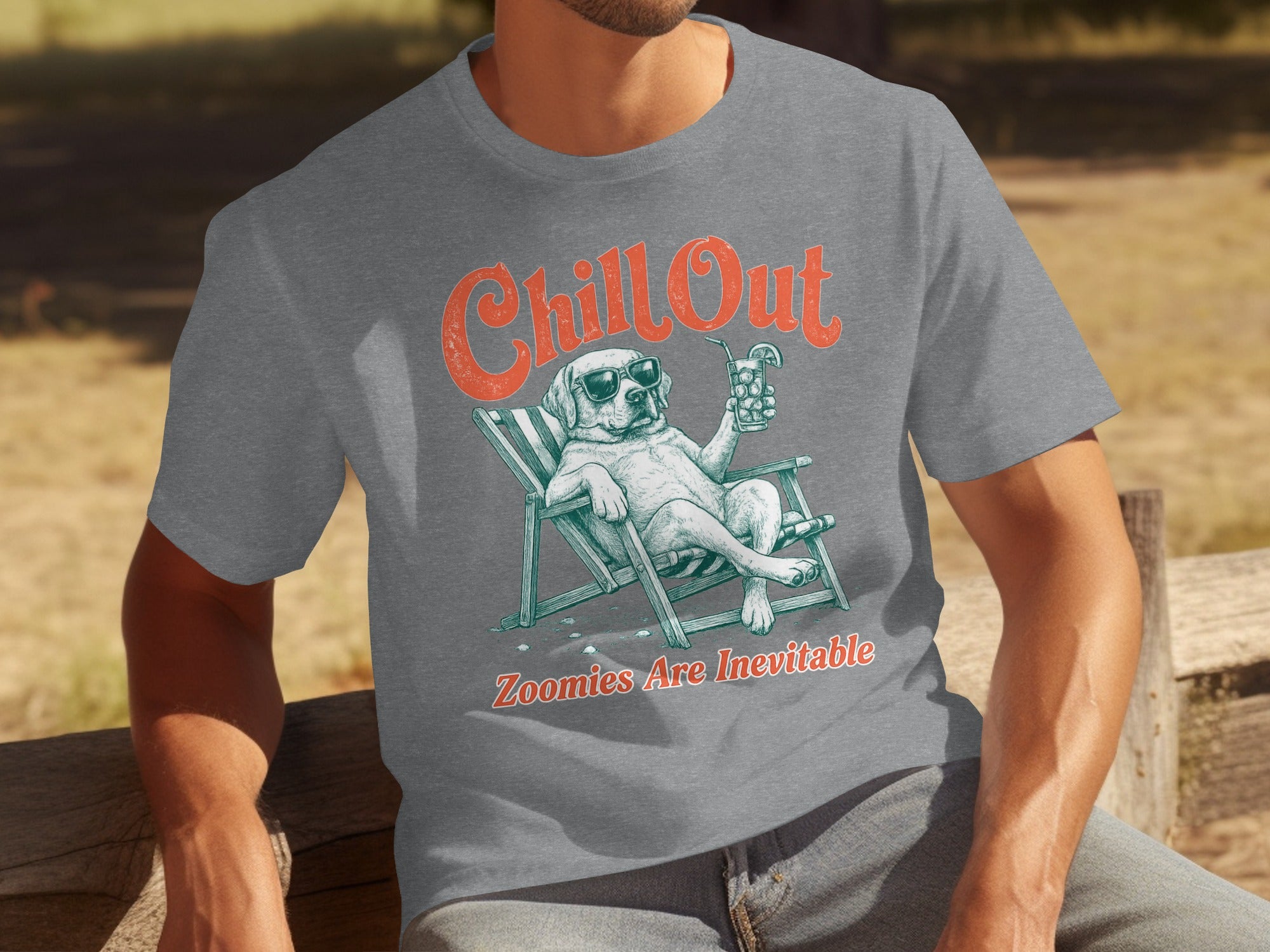 Man in grey t-shirt with "Chill Out Zoomies Are Inevitable" graphic of a dog.