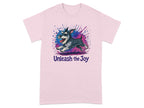 Pink t-shirt with a happy schnauzer jumping with watercolor splatter and "Unleash the Joy" text.