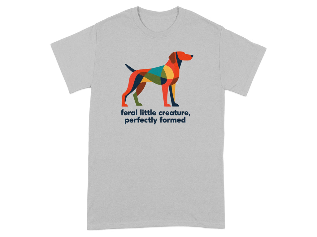 Grey t-shirt with colorful geometric dog and text "feral little creature, perfectly formed."