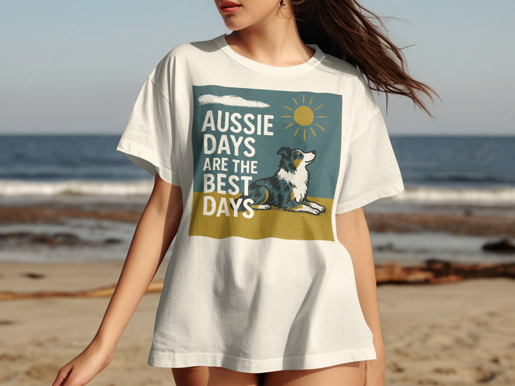 White t-shirt with "Aussie Days Are The Best Days" text and a lying border collie.