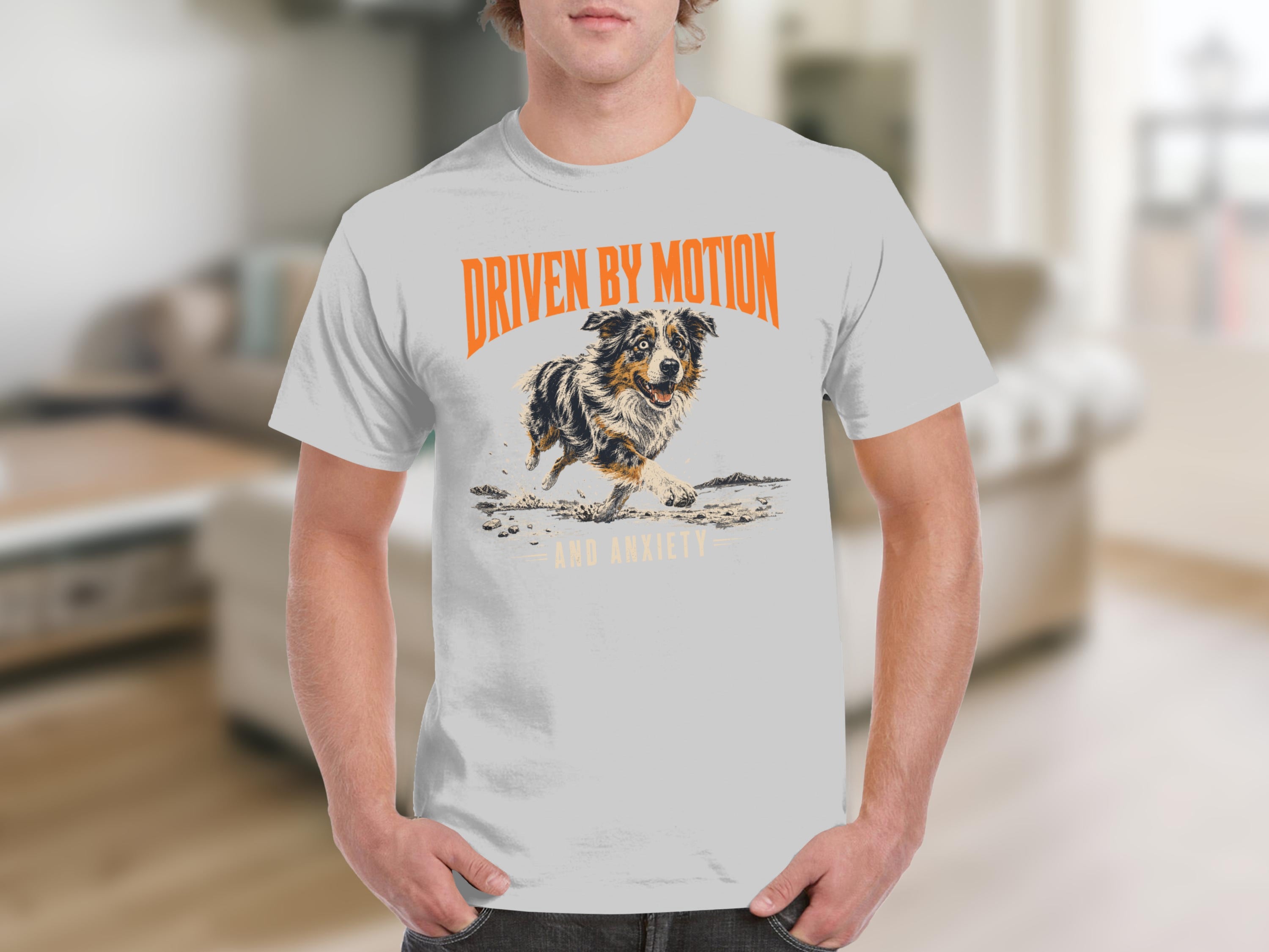 White t-shirt with orange text "DRIVEN BY MOTION AND ANXIETY" and a running dog.