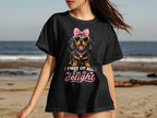 Black t-shirt with a dachshund wearing sunglasses and a bow saying "First of all, I'm a delight".