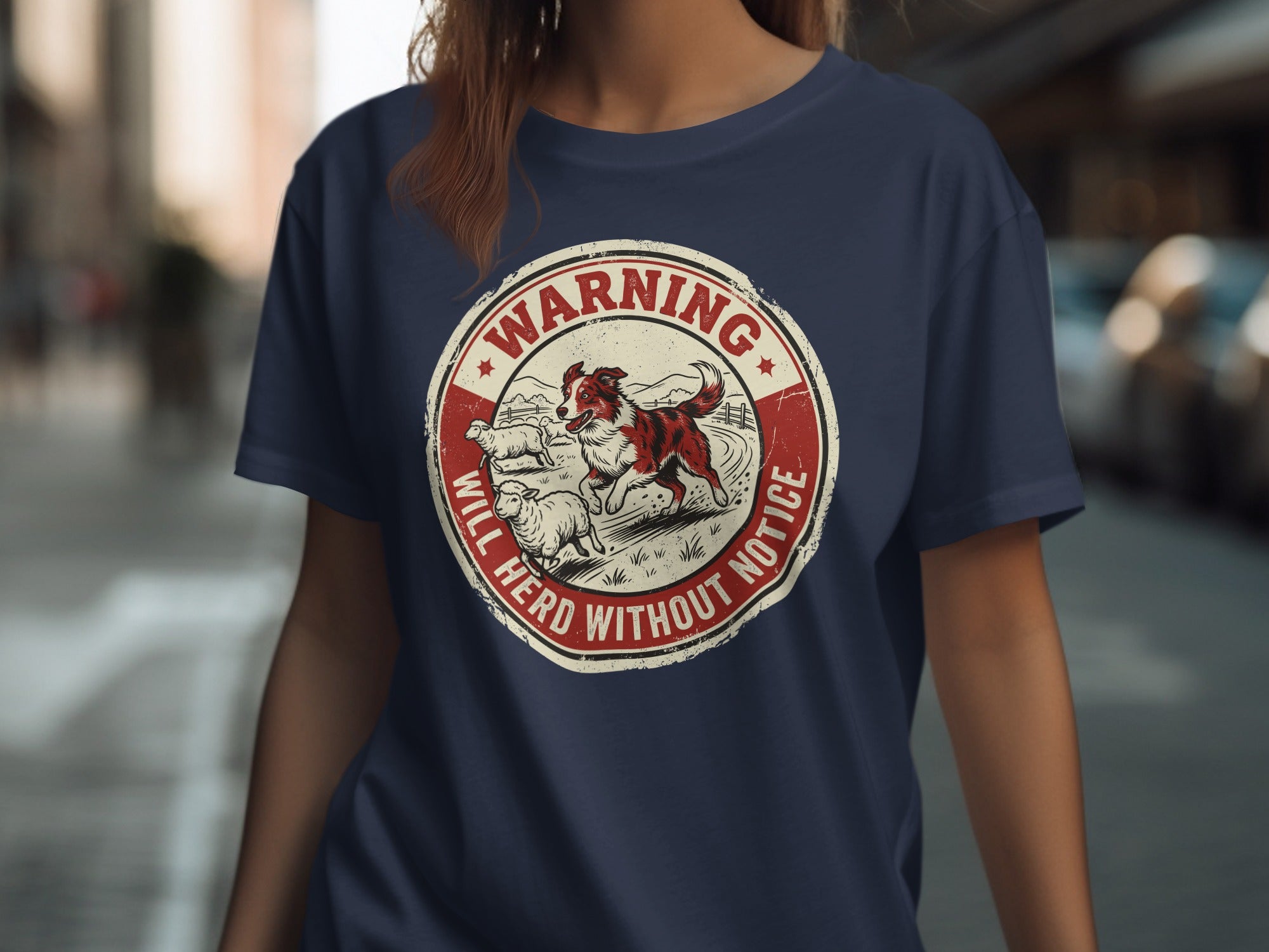 Circular badge with dog herding sheep, text "WARNING WILL HERD WITHOUT NOTICE".