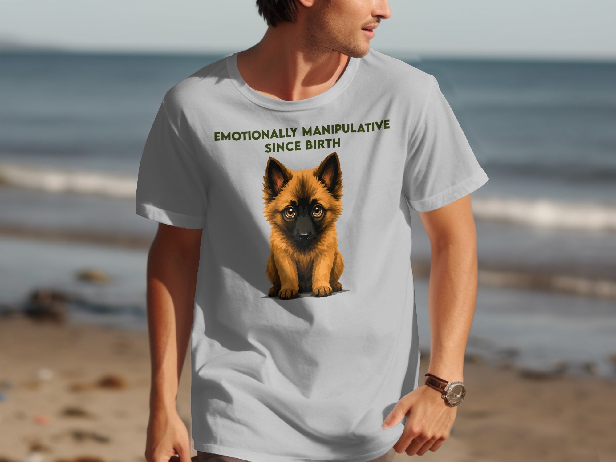 Light grey t-shirt with a cute dog and "Emotionally Manipulative Since Birth" text.