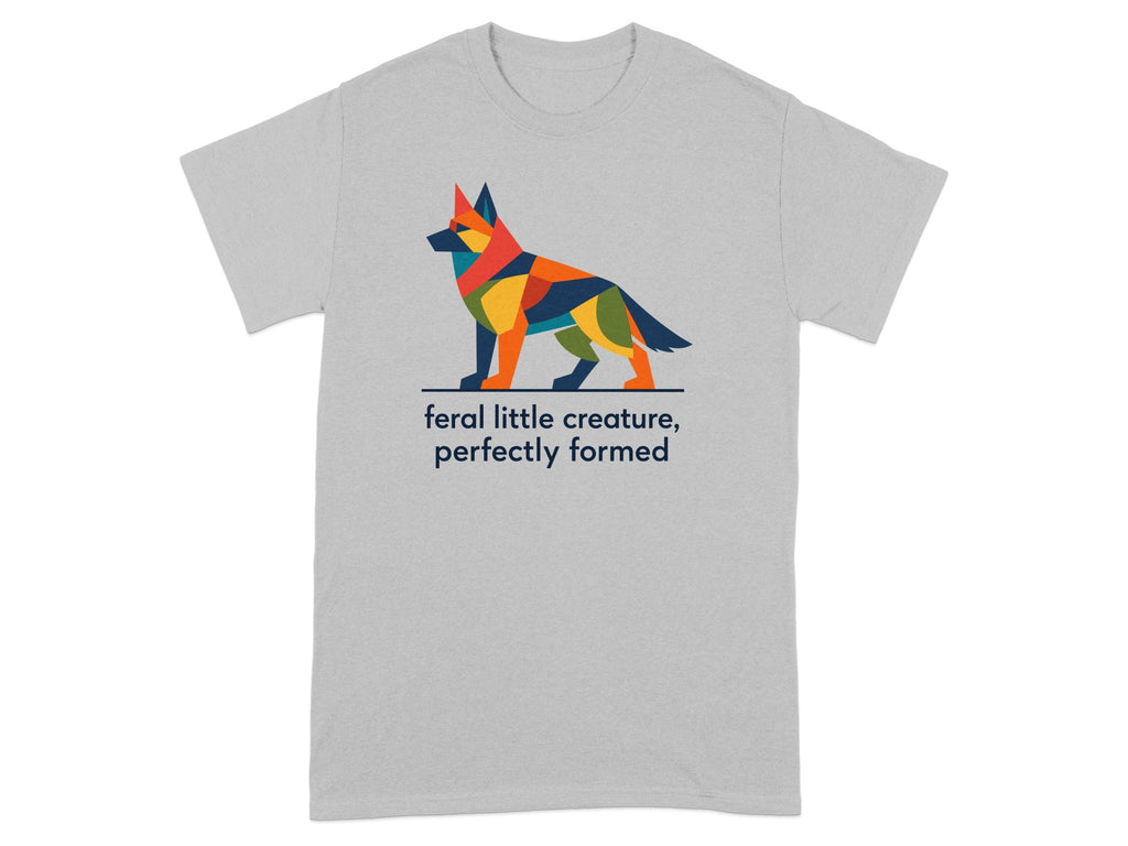 T-shirt with a colorful geometric dog and text "feral little creature, perfectly formed".