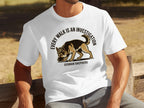 German Shepherd sniffing on a t-shirt that reads "Every Walk is an Investigation".
