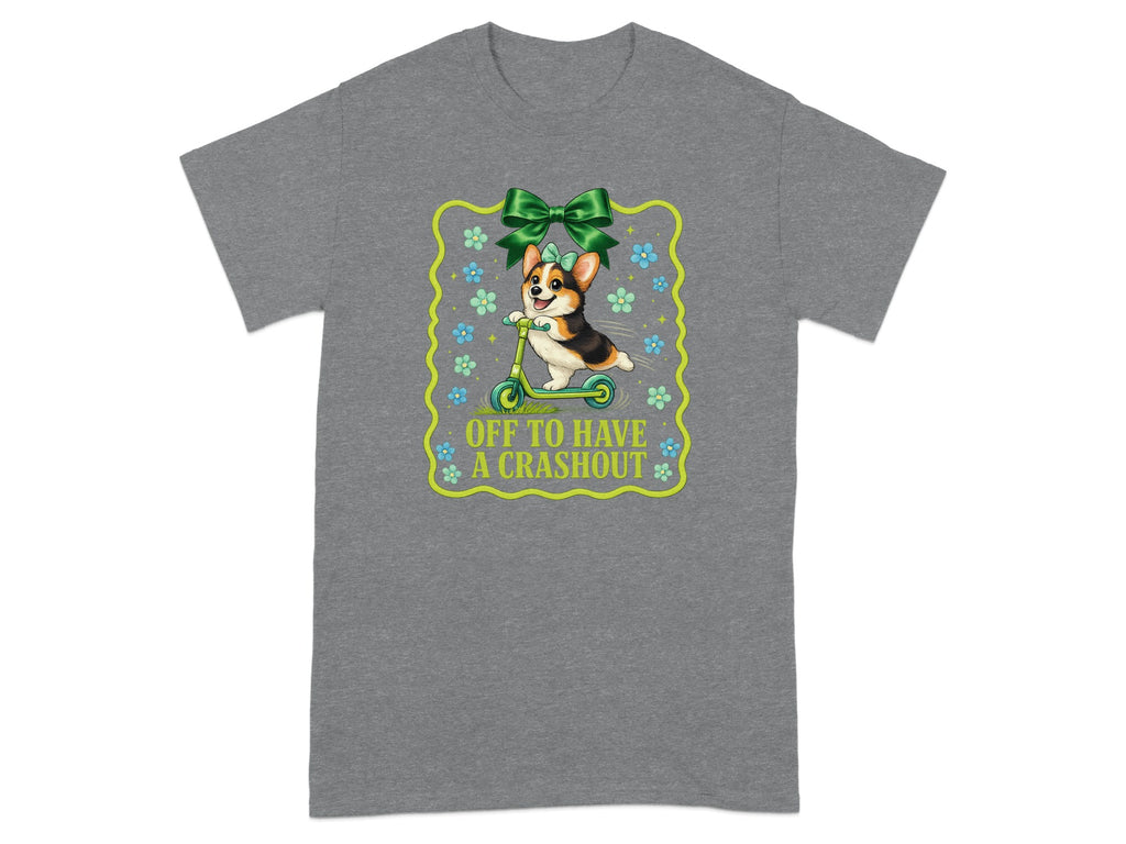 Corgi riding a scooter with green bow and text "OFF TO HAVE A CRASHOUT".