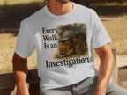 White t-shirt with Dachshund wearing a detective hat and text: "Every Walk Is an Investigation".