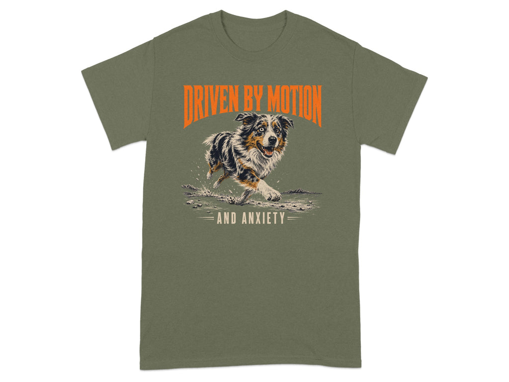 Dog running with "Driven by Motion and Anxiety" text on olive green t-shirt.