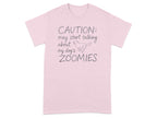 Pink t-shirt with "CAUTION: may start talking about my dog's ZOOMIES" text.
