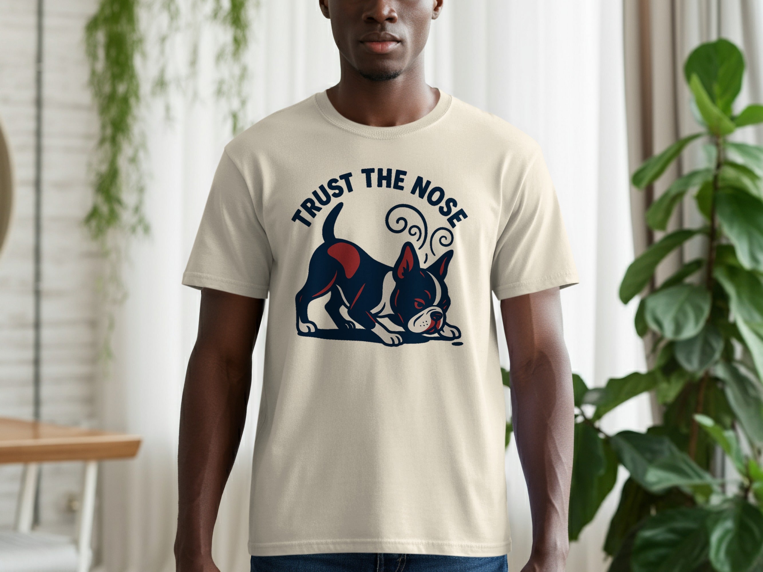 Cream t-shirt with graphic of a Boston terrier and text "TRUST THE NOSE".